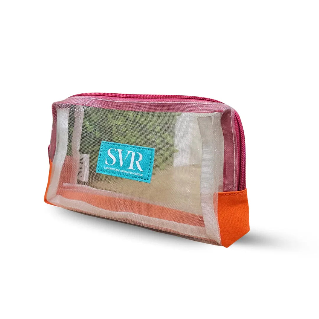 Trousse de toilette transparente SVR avec zip rose et base orange, contenant des produits dermocosmétiques | La Para Du Lac
